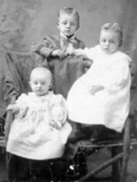 Gertrude, her older brother Harry, and baby sister Martha Klein